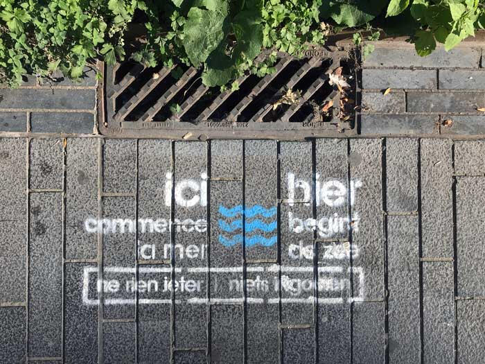 City signage, Brussels - behavioural design in public space encourages residents to rethink littering, reminding them that 'the sea starts here'.
