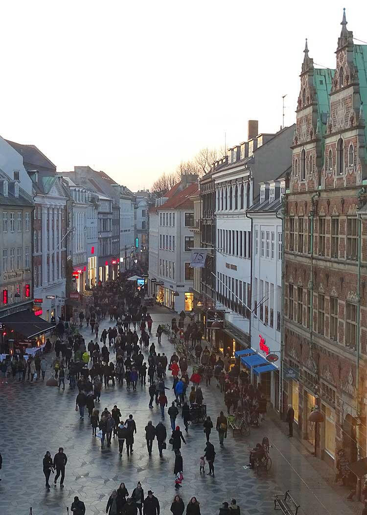People-watching, Copenhagen - the steady flow of pedestrians along Strøget, observed from the calm interior of Hay House, reflects the city’s walkable public life.