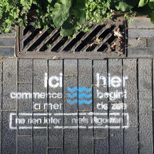 City signage, Brussels - a reminder that “the sea starts here”, turning a drain into a prompt to think about where our rubbish goes.
